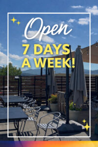 Outdoor patio seating with umbrellas and &ldquo;Open 7 Days a Week!&rdquo; text overlay
